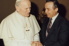 His Holiness Pope John Paul II greets CESJ President Norman Kurland, commending the work of the Center for Economic and Social Justice, 1987.
