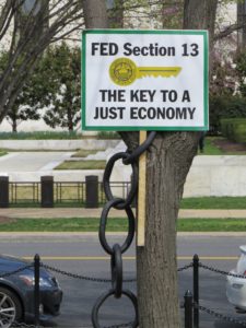 Protest sign - Fed Section 13: The Key to a Just Economy